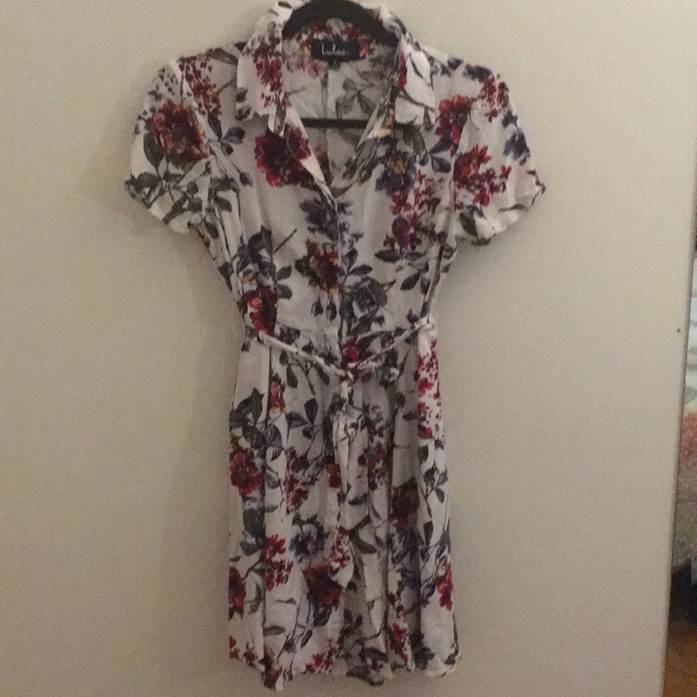 White dress with red flower and leaf pattern.
